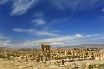 Algeria. Timgad (ancient Thamugadi or Thamugas). General view of Roman city with Trajan's Arch in...