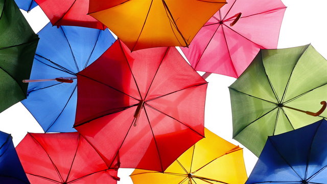 Colourful umbrellas open in the sky as a decoration