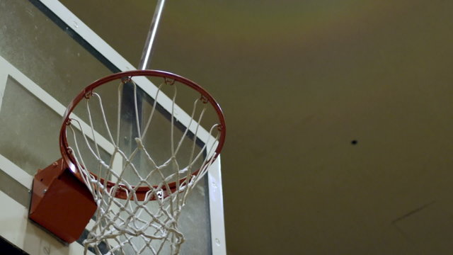 Slam dunk by a young man.