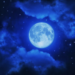 Fototapeta na wymiar Full moon in blue night sky