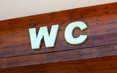 Letter WC on wooden planks