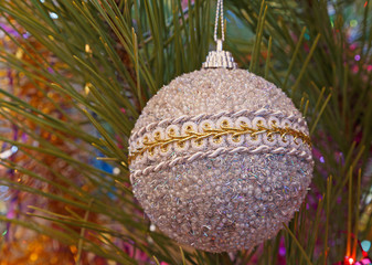 silver christmas tree ball on pine tree