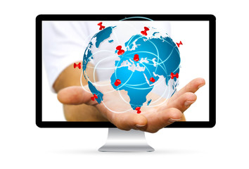 Businessman escaping from computer holding digital world map in