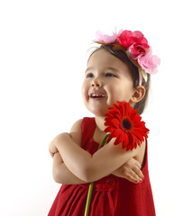 little girl in red dress embracing a red berbera