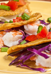 Plantain taco shell-fliied with shrimp, tomatoes, green onion, red cabbage, parsley