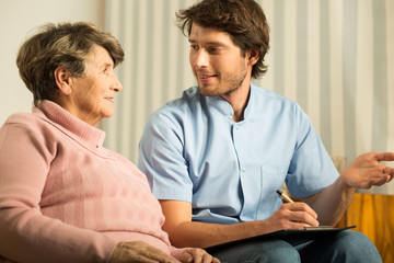 Senior female talking with doctor