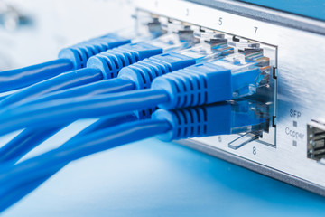 Network switch and ethernet cables - obrazy, fototapety, plakaty