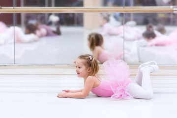 Naklejka premium Little ballerina at ballet class