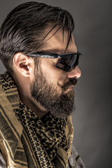 Fototapeta premium Closeup portrait of a man with beard wearing a traditional arab