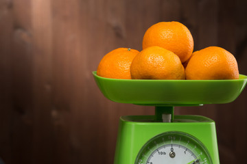 Fresh tangerine on the scales green