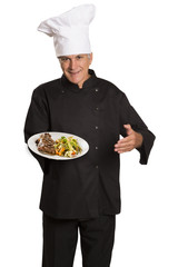 Chef holding plate with roasted meat