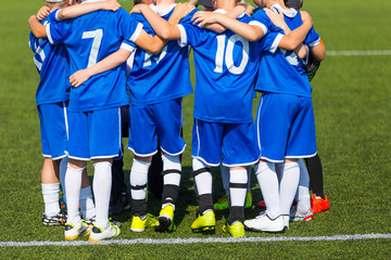 Coach giving children's soccer team instructions. Youth soccer team before final game © matimix