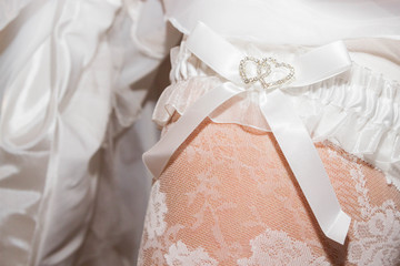Bride's garter with two hearts of one foot on the sock