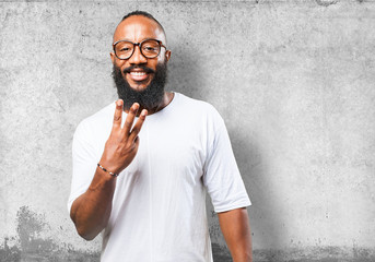 black man doing number three sign