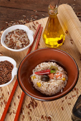 Rice salad with vegetables in bowl