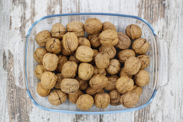 Walnuts in a glass tray