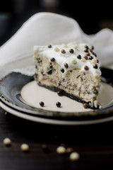 piece of cake with cream and chocolate  balls 