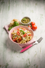 pasta with pesto  tomato e parmesan cheese flake