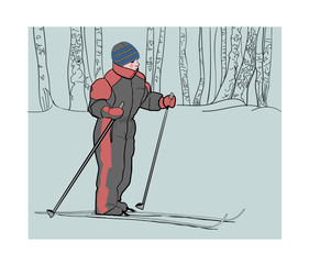 Boy on skis in the winter woods on a walk.