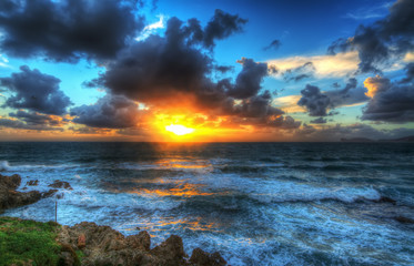 Obraz premium clouds over Alghero shore at sunset
