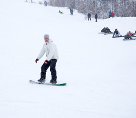 Young man snowboarding