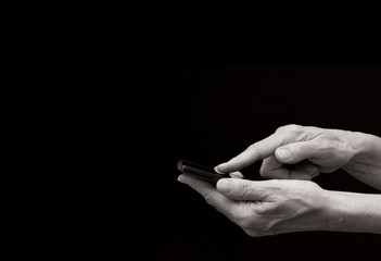 smartphone in hand monotone with black background