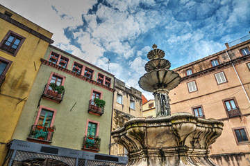 Fototapeta premium Fountain and buildings in Bosa