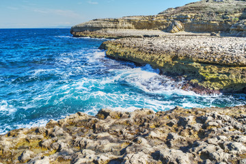 Rocky shore and blue water in Sardinia