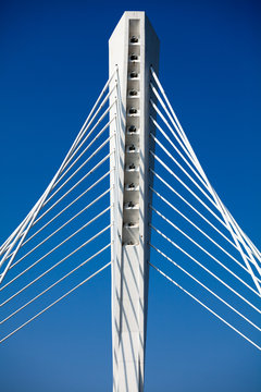Wonderful white bridge structure over clear blue sky