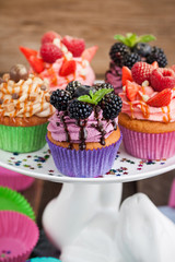 Set of different delicious cupcakes