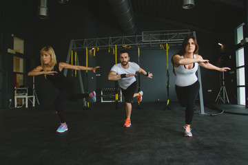 group of people in a gym exercising