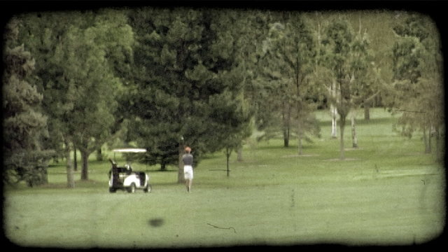 Man swings golf club. Vintage stylized video clip.