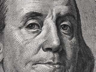 Ben Franklin face on us one hundred dollar bill macro,  united states money closeup