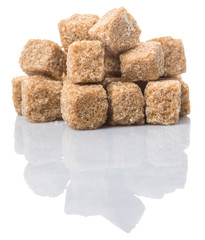 Brown sugarcane sugar cube over white background