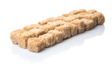 Brown sugarcane sugar cube over white background