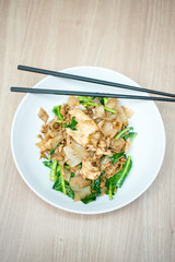 Asian stir fried flat rice noodles. Pad se ew with chicken