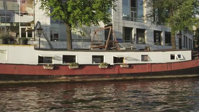 Houseboats along the embankment in Amsterdam