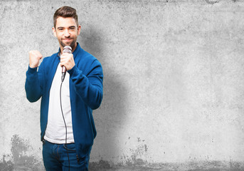 young man singing with a microphone
