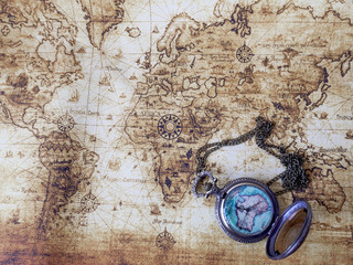Pocket watch  on vintage map. Retro style.