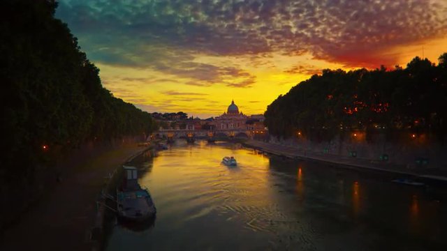Vibrant sunset time-lapse of the Vatican City, from across the Tevere River.