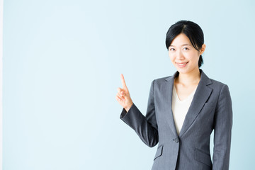 asian businesswoman isolated on blue background