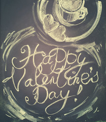 Lettering happy Valentines Day. Cup of hot tea, cookies