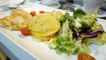 Grilled mountain chicken serving with fresh salad