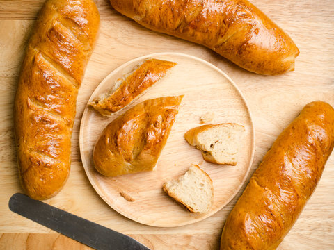 Fresh bread on wooden background