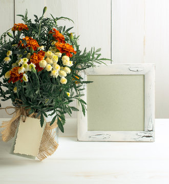 Tagetes flower bouquet with photo frame