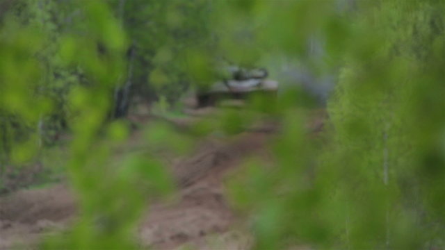 T-72 leaves from the forest.