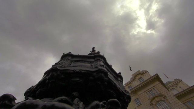 Birds landing on the Eros statue in London