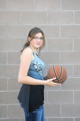 Female basketball player expressions with her ball.