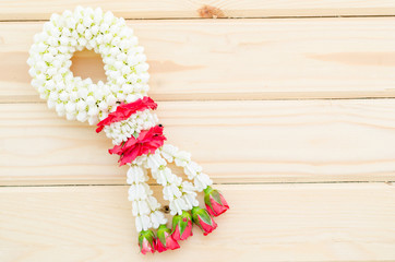 Jasmine garland of flowers on banana leaf background