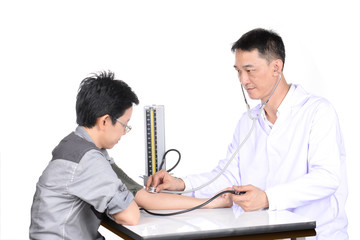 Doctor checking patient in the examination room.